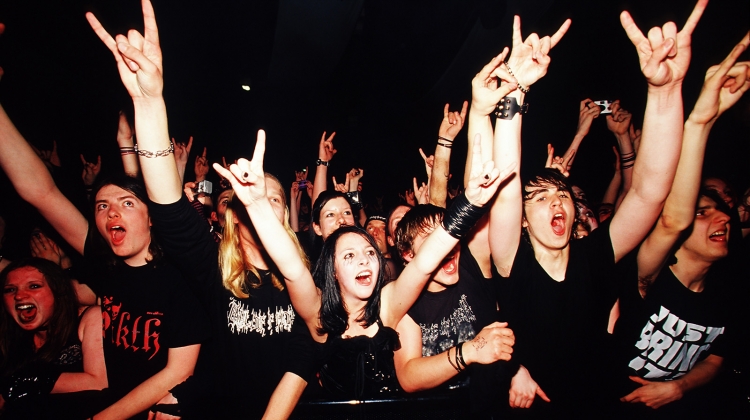 metal fans crowd mosh pit, PYMCA/UIG via Getty Images